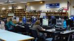 Kids working at computers in the library